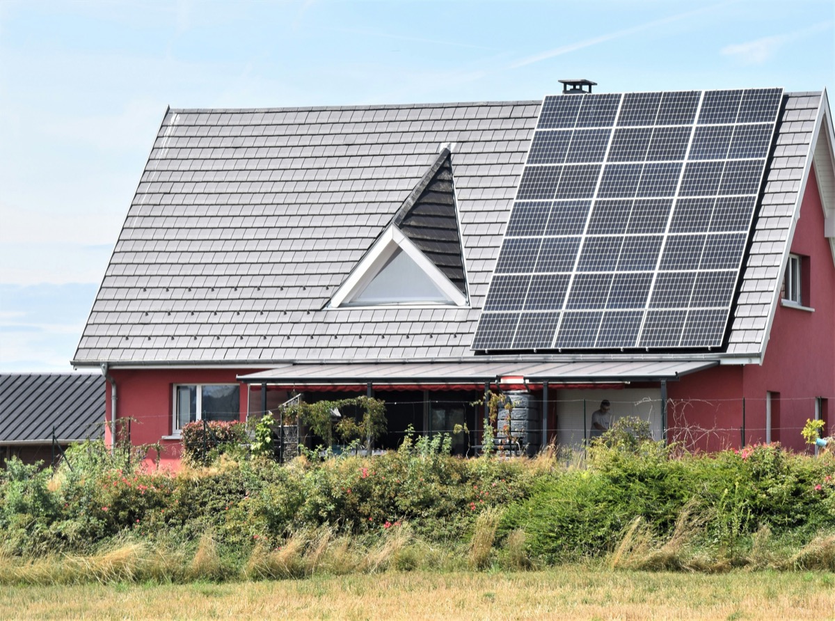 Solar panels fitted beside a roof window