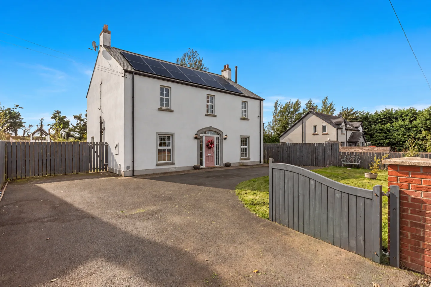 Illustrative solar panel array added to a real Ballygowan home photograph